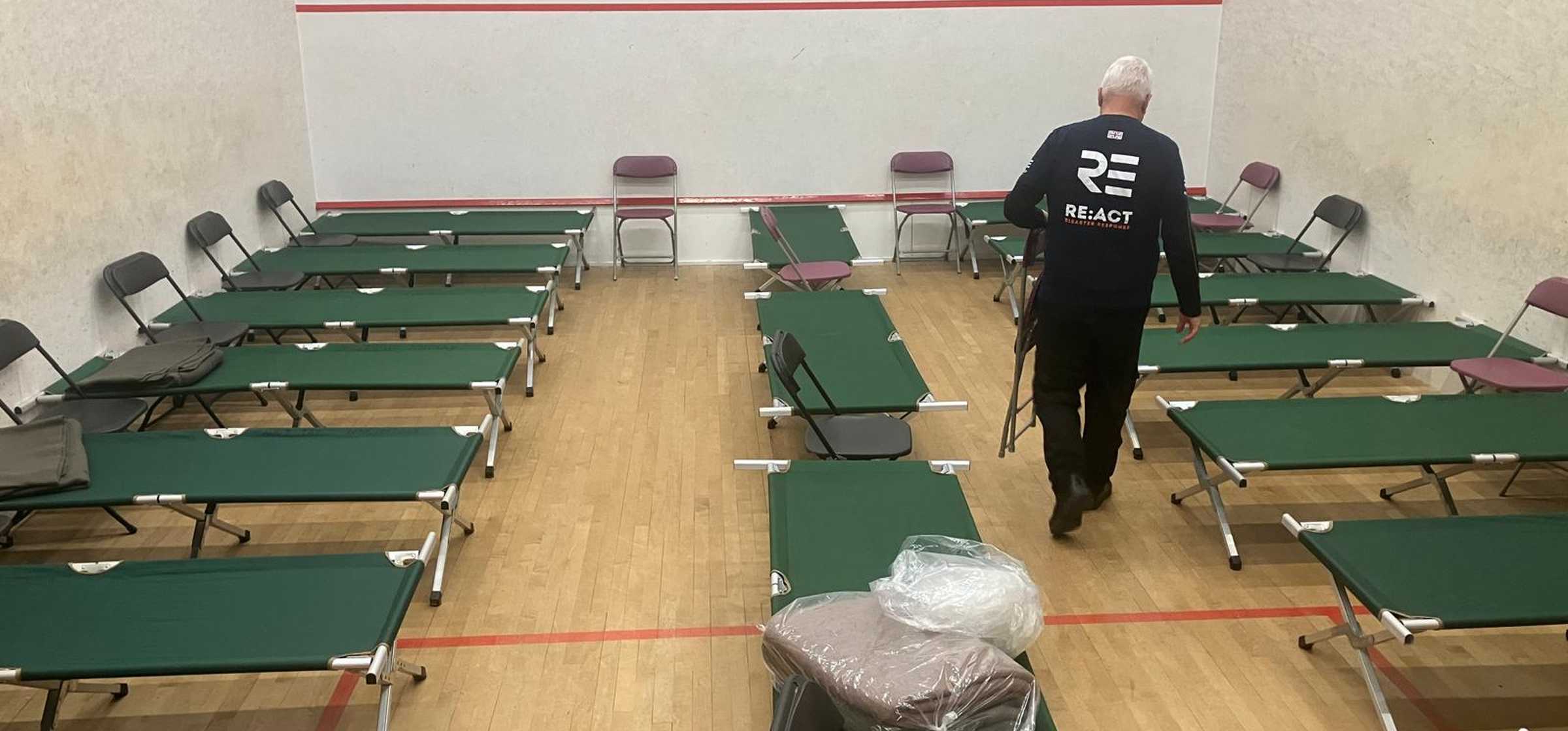 Responder preparing camp beds at rest centre 4_Matt Ladbrook.jpeg